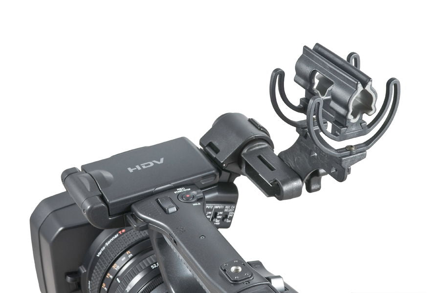 Shock-mounted shotgun mic bracket with lyre cradle on camera
