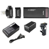AD200Pro TTL flash kit with battery pack, charger, cables, and mount bracket