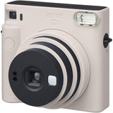 Chalk white Instax SQ1 instant camera close-up of lens rings and view area