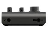 Side view of black audio interface with headphone jack and two rear connection ports