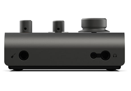 Side view of black audio interface with headphone jack and two rear connection ports