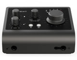 Front angled view of black USB audio interface with multiple knobs and visible connection jacks