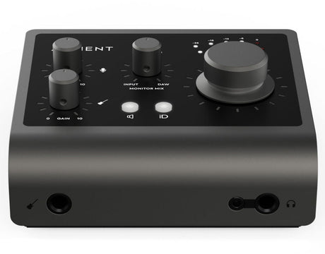 Front angled view of black USB audio interface with multiple knobs and visible connection jacks