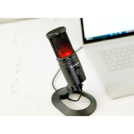 Black USB condenser microphone with red LED level indicators