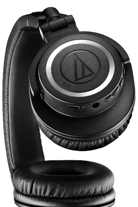 Black over-ear headphones, top view showing earcup controls and side ports