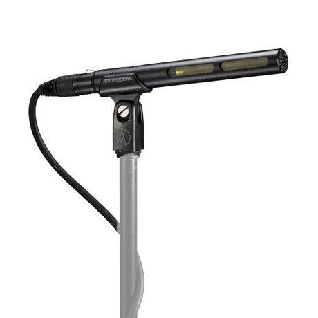 Shotgun microphone with shock mount and cable, angled view