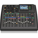 Front view of compact digital mixer with faders, backlit buttons, and screen interface
