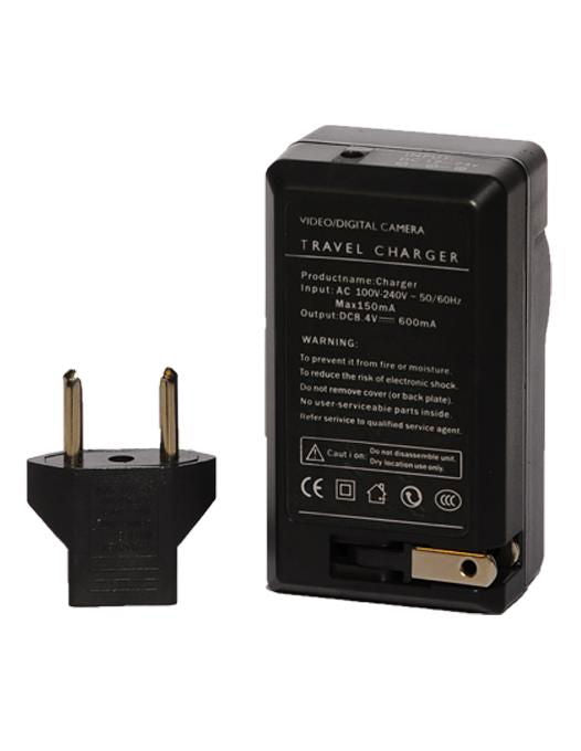Back of black travel charger with two-pin plug and battery compartment