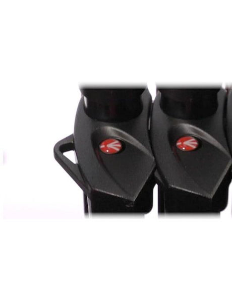 Close-up of black tripod head plate with red circular logo