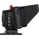 Studio camera rear side with port cluster, knobs, and red “8” top marker