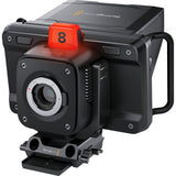 Angled studio camera side view with red tally light, lens housing and vented body