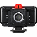 Black camera body with lens mount and red top marker marked 8