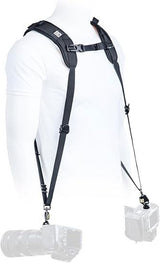 Black dual shoulder harness with webbing straps and hanging camera clip ends