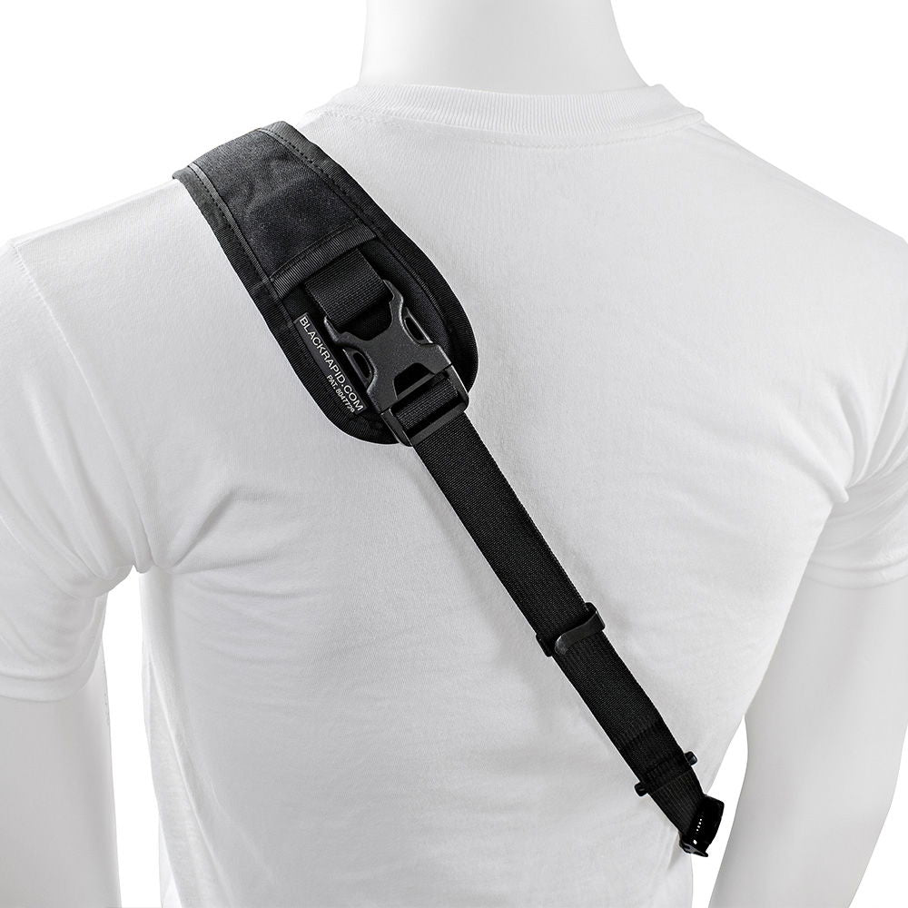 Black padded camera strap with attachment clip and webbing adjustment sliders