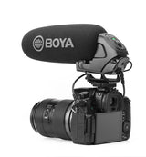 Shotgun condenser mic with foam windscreen mounted on camera