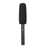 Shotgun microphone with black foam windscreen on a slim cylindrical body