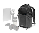 Black photo backpack with front compartments, top handle, and adjustable shoulder straps