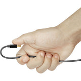 Hand holding ultra-thin 35 cm HDMI cable with black connectors