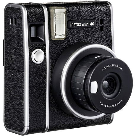 instax mini 40 instant camera, angled front showing focus range lens cover