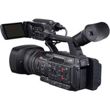 Camcorder rear view with LCD screen, microphone, and shoulder mount