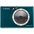 Dark teal instant camera front with lens and Canon branding