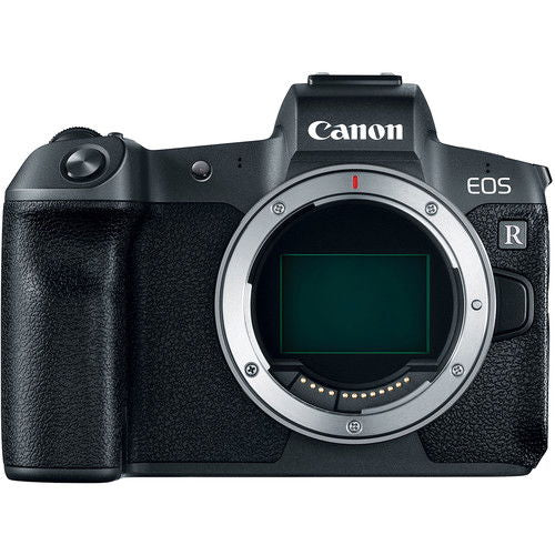 Black mirrorless camera body, front view with lens mount and control dial
