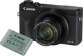 Digital camera with zoom lens and included extra rechargeable battery