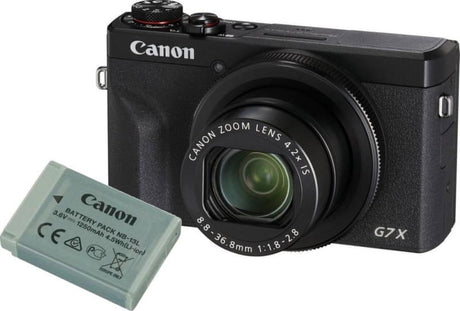 Digital camera with zoom lens and included extra rechargeable battery