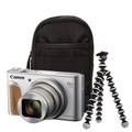 Silver compact camera with black case and small tabletop tripod