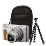 Silver compact camera with black case and small tabletop tripod