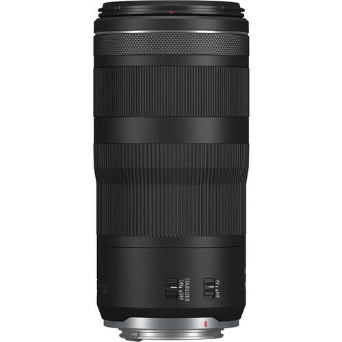 Black 100-400mm telephoto lens, rear mount and textured grip rings visible