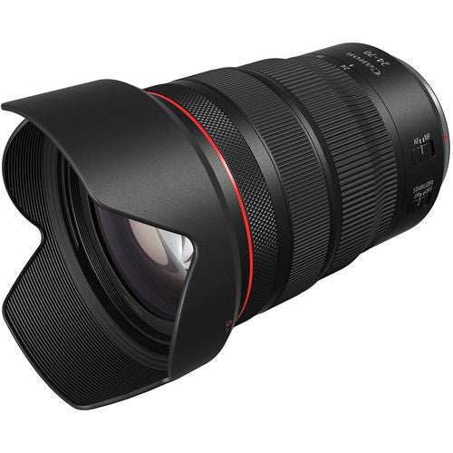 Angled view of black 24-70mm camera lens with front glass and red accent ring