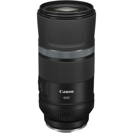 Black telephoto lens barrel with ribbed grip and silver band near center
