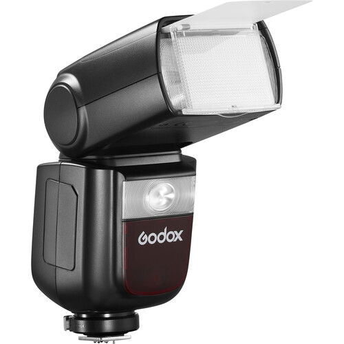 Black TTL speedlight with extended head showing diffuser and front control area