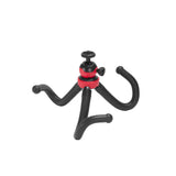 Mini tripod with red ball-head knob and curved black legs, side view