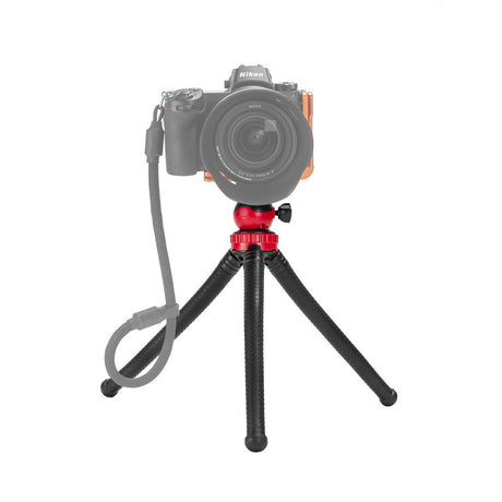 Mini tripod with ball head holding a DSLR camera; black textured legs