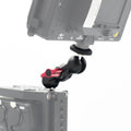Monitor magic arm mount with black clamp and red adjustment knobs