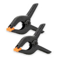 Set of 2 black plastic spring clamps, M size, with orange release tabs