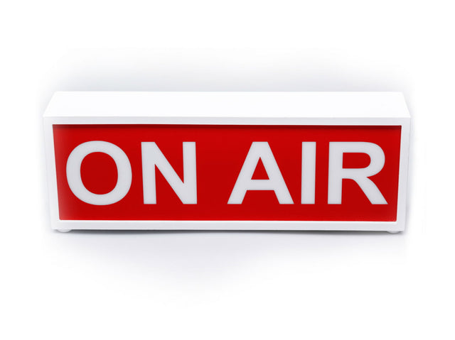ON AIR light box sign with bold white letters on red panel, in white casing.