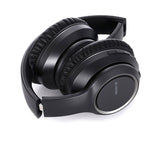 Black over-ear headphones with cushioned earcups and touch/arrow buttons on side