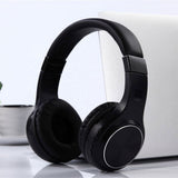 Black wireless over-ear headphones with padded headband and round cushioned ear cups