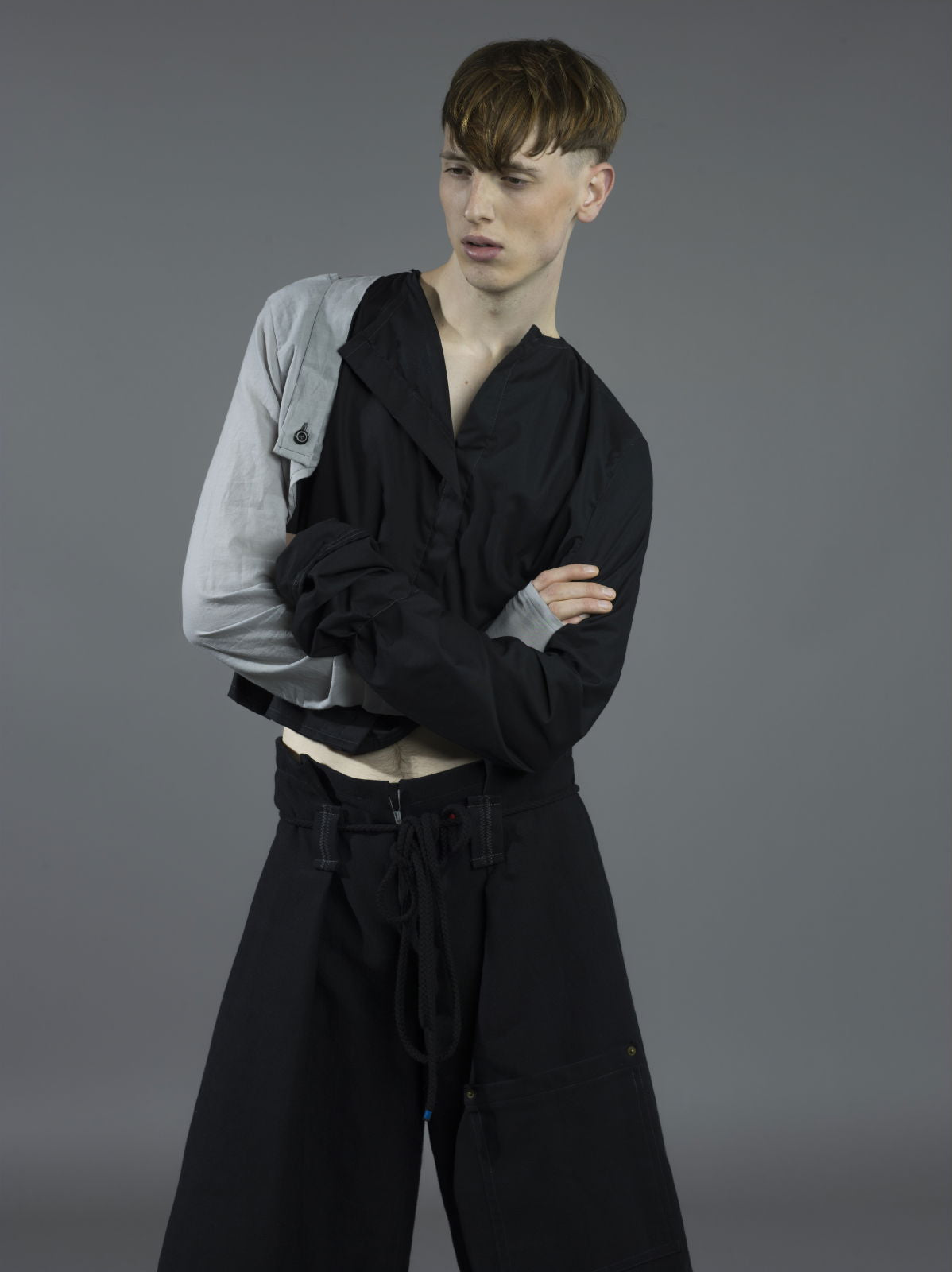 Photo backdrop sheet in studio, with model posing against it