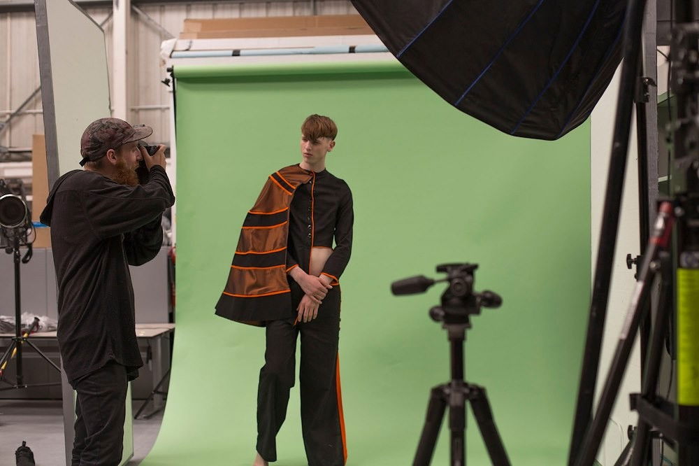 Green photo backdrop panel in photography studio setup