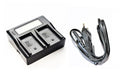 Dual LCD battery charger with two charging bays and AC power cord