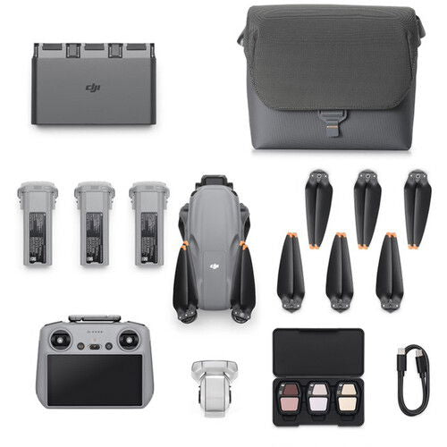 Air 3S Fly More kit laid out: controller, extra batteries, propellers, charger case, cables.