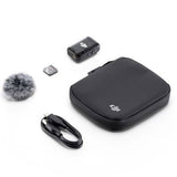 Wireless transmitter kit: black case, USB cable, and clip mic accessory