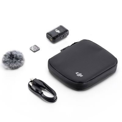 Wireless transmitter kit: black case, USB cable, and clip mic accessory