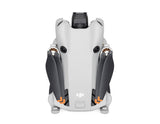 Mini 4 Pro drone rear view, white shell with vents, dark gray arms and prop guards