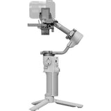 Light gray 3-axis gimbal stabilizer with camera rig, angled arm and tripod base
