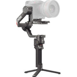 DJI RS 4 Pro gimbal stabilizer with long lens, top plate, and tripod legs